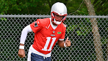 Jun 9, 2025; Foxborough, MA, USA; New England Patriots quarterback Joshua Dobbs (11) jogs to the practice fields at Gillette Stadium. Mandatory Credit: Eric Canha-Imagn Images