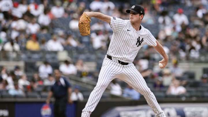 Jul 21, 2024; Bronx, New York, USA; New York Yankees pitcher Caleb Ferguson (64) pitches against the Tampa Bay Rays at Yankee Stadium. Mandatory Credit: John Jones-USA TODAY Sports