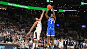 Nov 15, 2025; Boston, Massachusetts, USA; BYU Cougars forward AJ Dybantsa (3) shoots the ball over .UConn Huskies guard Silas Demary Jr. (2) during the second half at TD Garden. Mandatory Credit: Eric Canha-Imagn Images