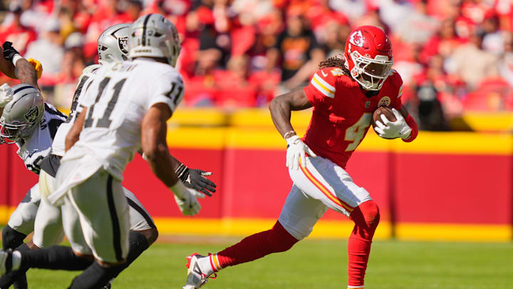 Oct 19, 2025; Kansas City, Missouri, USA; Kansas City Chiefs wide receiver Rashee Rice (4) carries the ball against the Las Vegas Raiders during the third quarter of the game at GEHA Field at Arrowhead Stadium. Mandatory Credit: Jay Biggerstaff-Imagn Images