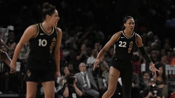 Sep 24, 2023; Las Vegas, Nevada, USA; Las Vegas Aces center A'ja Wilson (22), guard Kelsey Plum (10) and center Kiah Stokes (41) celebrate against the Dallas Wings during game one of the 2023 WNBA Semifinals at Michelob Ultra Arena. The Aces defeated the Wings 97-83. Mandatory Credit: Kirby Lee-Imagn Images