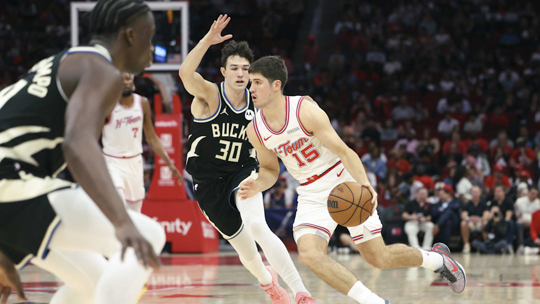 Apr 1, 2026; Houston, Texas, USA; Houston Rockets guard Reed Sheppard (15) dribbles the ball as Milwaukee Bucks guard Cormac Ryan (30) defends during the first quarter at Toyota Center. Mandatory Credit: Troy Taormina-Imagn Images