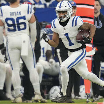 Dec 22, 2024; Indianapolis, Indiana, USA; Indianapolis Colts wide receiver Josh Downs (1) rushes the ball  during a game against the Tennessee Titan at Lucas Oil Stadium. Mandatory Credit: Christine Tannous/USA Today Network via Imagn Images 