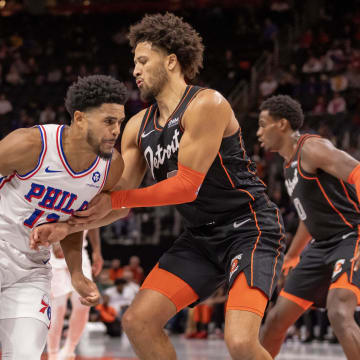 Nov 10, 2023; Detroit, Michigan, USA; Detroit Pistons guard Cade Cunningham (2) defends against Philadelphia 76ers forward Tobias Harris (12) during the in the first half at Little Caesars Arena. Mandatory Credit: David Reginek-USA TODAY Sports