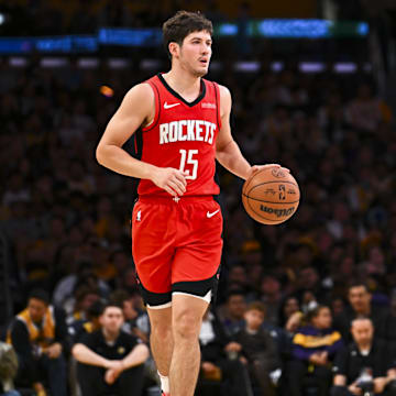 Apr 11, 2025; Los Angeles, California, USA; Houston Rockets guard Reed Sheppard (15) moves the ball against the Los Angeles Lakers during the second half at Crypto.com Arena. Mandatory Credit: Jonathan Hui-Imagn Images