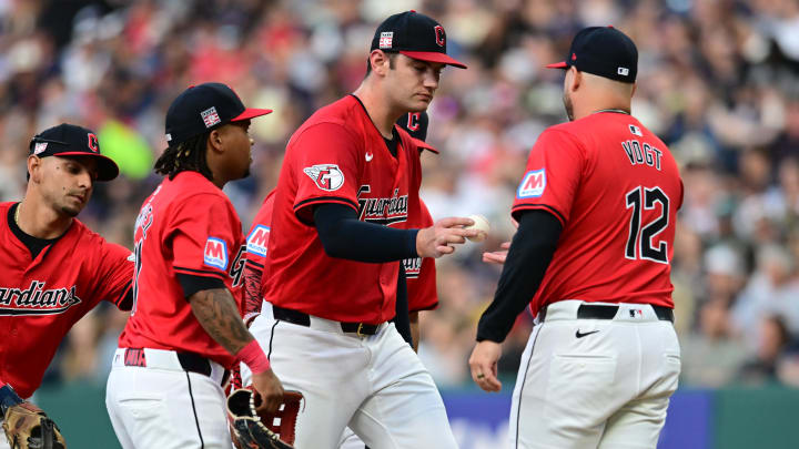 Jul 20, 2024; Cleveland, Ohio, USA; Cleveland Guardians manager Stephen Vogt (12) relieves starting pitcher Gavin Williams (32) during the fourth inning against the San Diego Padres at Progressive Field. Mandatory Credit: Ken Blaze-USA TODAY Sports