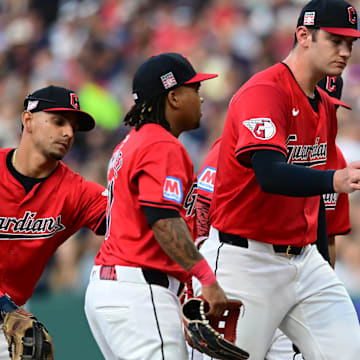 Jul 20, 2024; Cleveland, Ohio, USA; Cleveland Guardians manager Stephen Vogt (12) relieves starting pitcher Gavin Williams (32) during the fourth inning against the San Diego Padres at Progressive Field. Mandatory Credit: Ken Blaze-Imagn Images