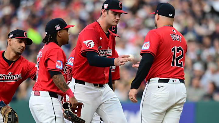 Jul 20, 2024; Cleveland, Ohio, USA; Cleveland Guardians manager Stephen Vogt (12) relieves starting pitcher Gavin Williams (32) during the fourth inning against the San Diego Padres at Progressive Field. Mandatory Credit: Ken Blaze-Imagn Images