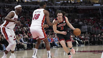 Apr 16, 2025; Chicago, Illinois, USA; Miami Heat guard Alec Burks (18) defends Chicago Bulls guard Josh Giddey (3) during the first quarter at United Center. Mandatory Credit: David Banks-Imagn Images