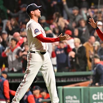 Apr 6, 2025; Boston, Massachusetts, USA; Boston Red Sox catcher Carlos Narvaez (75) and relief pitcher Cooper Criswell (64) celebrate defeating the St. Louis Cardinals at Fenway Park. Mandatory Credit: Eric Canha-Imagn Images