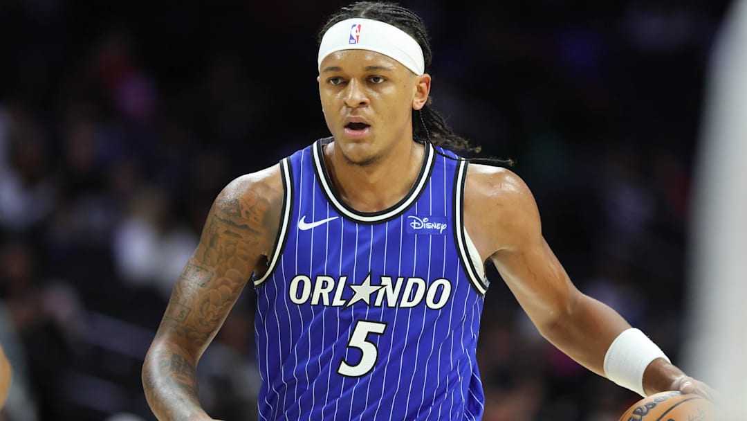Oct 10, 2025; Philadelphia, Pennsylvania, USA; Orlando Magic forward Paolo Banchero (5) dribbles the ball against the Philadelphia 76ers during the third quarter at Xfinity Mobile Arena. Mandatory Credit: Bill Streicher-Imagn Images