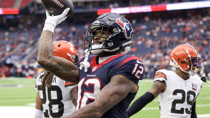 Dec 24, 2023; Houston, Texas, USA; Houston Texans wide receiver Nico Collins (12) celebrates his touchdown against the Cleveland Browns in the fourth quarter at NRG Stadium. Mandatory Credit: Thomas Shea-Imagn Images