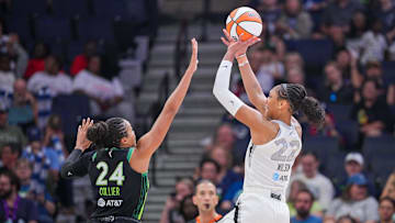 Jul 25, 2025; Minneapolis, Minnesota, USA; Las Vegas Aces center A'ja Wilson (22) shoots against the Minnesota Lynx forward Napheesa Collier (24) in the third quarter at Target Center. Mandatory Credit: Brad Rempel-Imagn Images
