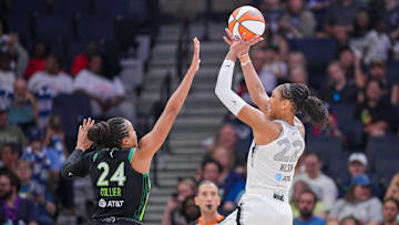 Las Vegas Aces center A'ja Wilson shoots against Minnesota Lynx forward Napheesa Collier.