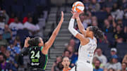 Jul 25, 2025; Minneapolis, Minnesota, USA; Las Vegas Aces center A'ja Wilson (22) shoots against the Minnesota Lynx forward Napheesa Collier (24) in the third quarter at Target Center. Mandatory Credit: Brad Rempel-Imagn Images