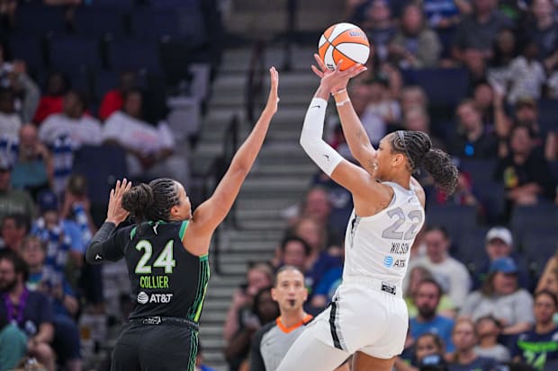Las Vegas Aces center A'ja Wilson (22) shoots against the Minnesota Lynx forward Napheesa Collier (24)