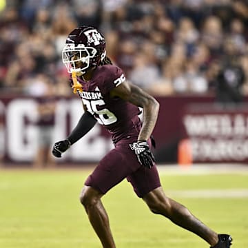 Nov 16, 2024; College Station, Texas, USA; Texas A&M Aggies defensive back Will Lee III (26) defends in coverage against the New Mexico State Aggies during the first half at Kyle Field. Mandatory Credit: Maria Lysaker-Imagn Images 