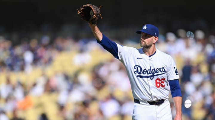 Jul 21, 2024; Los Angeles, California, USA; Los Angeles Dodgers pitcher James Paxton (65) at the mount against the Boston Red Sox during the first inning at Dodger Stadium.