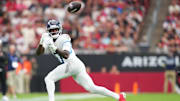 Oct 5, 2025; Glendale, Arizona, USA; Tennessee Titans wide receiver Calvin Ridley (0) makes a catch against the Arizona Cardinals during the second quarter at State Farm Stadium. Mandatory Credit: Joe Camporeale-Imagn Images