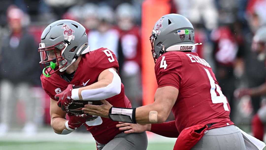 Oct 25, 2025; Pullman, Washington, USA; Washington State Cougars running back Kirby Vorhees (9) takes the hand off from Washington State Cougars quarterback Zevi Eckhaus (4) against the Toledo Rockets in the first half at Gesa Field at Martin Stadium. Mandatory Credit: James Snook-Imagn Images