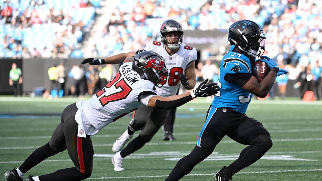 Oct 25, 2026; Charlotte, North Carolina, USA; Carolina Panthers running back Anthony Tyus III (34) runs against Tampa Bay Buccaneers cornerback Zyon McCollum (27) during the second half at Bank of America Stadium. Mandatory Credit: Bob Donnan-Imagn Images Oct 25, 2026; Charlotte, North Carolina, USA; Carolina Panthers running back Anthony Tyus III (34) runs against Tampa Bay Buccaneers cornerback Zyon McCollum (27) during the second half at Bank of America Stadium. Mandatory Credit: Bob Donnan-Imagn Images