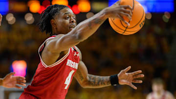 Wisconsin Badgers guard Kamari McGee (4) grabs a rebound during the first half against the Maryland Terrapins at Xfinity Center. Mandatory Credit: Reggie Hildred-Imagn Images