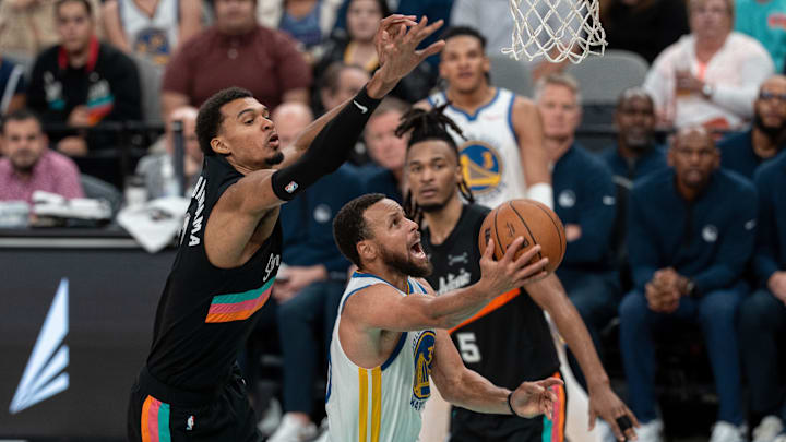 Wembanyama (left) and Curry (right) faced off in an entertaining 125-120 win for the Warriors over the Spurs. 