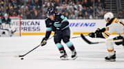 Dec 12, 2024; Seattle, Washington, USA; Seattle Kraken right wing Daniel Sprong (91) plays the puck during the third period against the Boston Bruins at Climate Pledge Arena. Mandatory Credit: Steven Bisig-Imagn Images