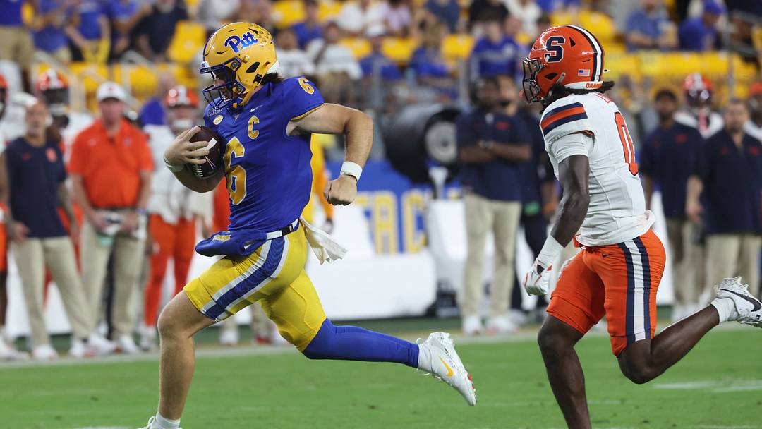 Sep 17, 2026; Pittsburgh, Pennsylvania, USA;  Pittsburgh Panthers quarterback Mason Heintschel (6) runs the ball -a- Syracuse Orange defensive back Duce Chestnut (0) during the second quarter at Acrisure Stadium.  Mandatory Credit: Charles LeClaire-Imagn Images