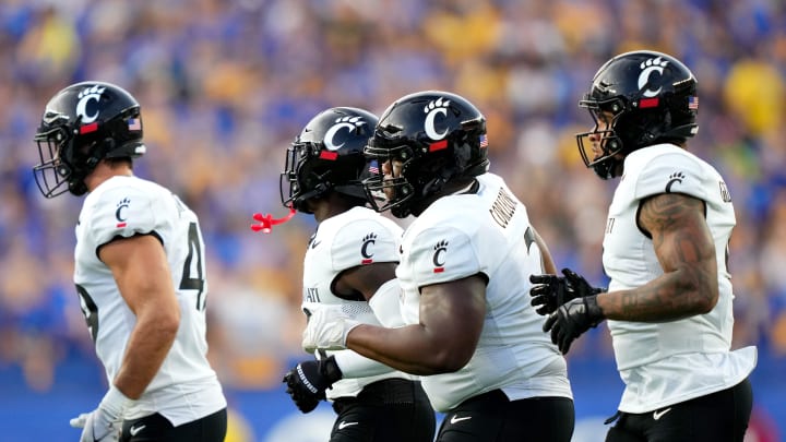 Cincinnati Bearcats defensive lineman Dontay Corleone, center, the Cincinnati Bearcats defense take the field in the first quarter of a college football game between the Cincinnati Bearcats at the Pittsburgh Panthers, Saturday, Sept. 9, 2023, at Acrisure Stadium in Pittsburgh, Pa.