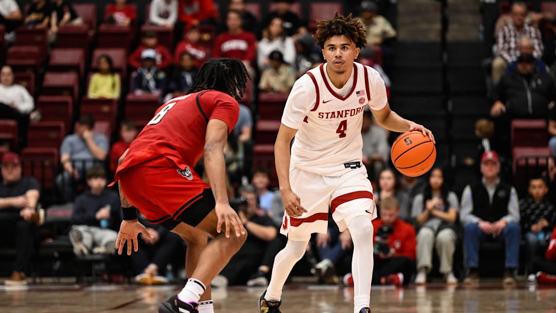 Feb 8, 2025; Stanford, California, USA; Stanford Cardinal guard Oziyah Sellers (4) dribbles against NC State Wolfpack guard Jayden Taylor (8) in the second half at Maples Pavilion. Mandatory Credit: Eakin Howard-Imagn Images