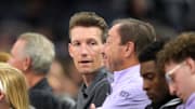 Jun 19, 2025; San Francisco, California, USA; Golden State Warriors general manager Mike Dunleavy (center left) talks with Golden State Valkyries co-owner Joe Lacob (center right) during the fourth quarter against the Indiana Fever at Chase Center. Mandatory Credit: Darren Yamashita-Imagn Images