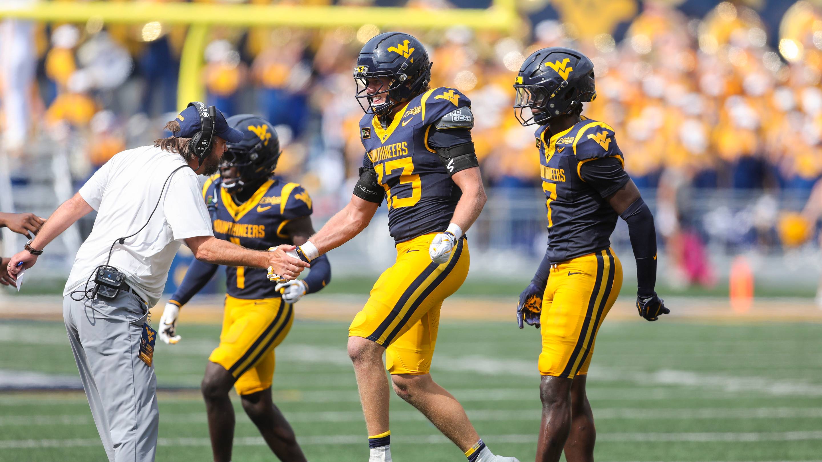 Sep 12, 2026; Morgantown, West Virginia, USA; West Virginia Mountaineers linebacker Ashton Woods (33) celebrates after intercepting a pass during the third quarter against the UT Martin Skyhawks at Milan Puskar Stadium. Mandatory Credit: Ben Queen-Imagn Images | IMAGN IMAGES via Reuters Connect