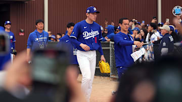Feb 12, 2025; Glendale, AZ, USA; Los Angeles Dodgers pitcher Roki Sasaki (11) takes the field during a Spring Training workout at Camelback Ranch. Mandatory Credit: Joe Camporeale-Imagn Images