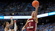 Jan 25, 2025; Chapel Hill, North Carolina, USA;  Boston College Eagles guard Dion Brown (1) shoots as North Carolina Tar Heels guard RJ Davis (4) defends in the first half at Dean E. Smith Center. Mandatory Credit: Bob Donnan-Imagn Images