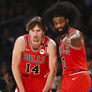 Mar 22, 2025; Los Angeles, California, USA; Chicago Bulls guard Coby White (0) points with Chicago Bulls forward Matas Buzelis (14) against the Los Angeles Lakers during the second half at Crypto.com Arena. Mandatory Credit: Jonathan Hui-Imagn Images