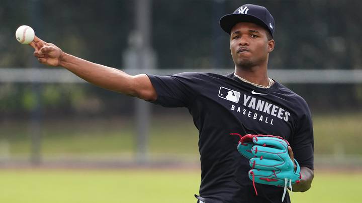 Feb 19, 2025; Tampa, FL, USA; New York Yankees pitcher Michael Arias (83) throws the ball during spring training practice  at George M. Steinbrenner Field. Mandatory Credit: Dave Nelson-Imagn Images