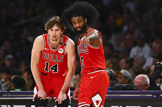Chicago Bulls guard Coby White (0) points with Chicago Bulls forward Matas Buzelis (14) 