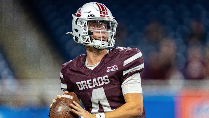 Dexter quarterback Cooper Arnedt (4) looks to pass during the first half of the MHSAA Division 2 football championship game against Orchard Lake St. Mary’s at Ford Field in Detroit on Friday, Nov. 28, 2025.