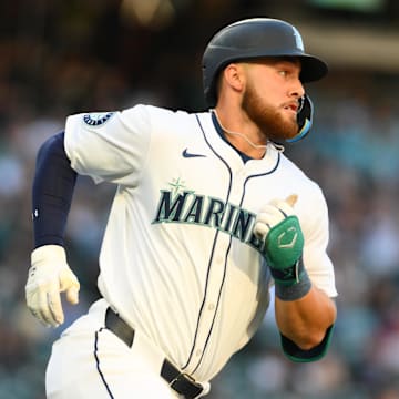Jul 23, 2024; Seattle, Washington, USA; Seattle Mariners first baseman Tyler Locklear (27) runs towards first base after hitting a single against the Los Angeles Angels during the second inning at T-Mobile Park. Mandatory Credit: Steven Bisig-Imagn Images