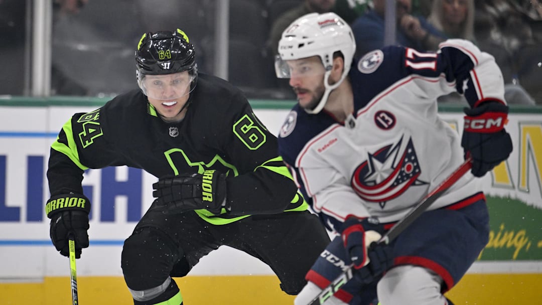 Feb 2, 2025; Dallas, Texas, USA; Dallas Stars center Mikael Granlund (64) chases Columbus Blue Jackets right wing Justin Danforth (17) during the first period at the American Airlines Center. Mandatory Credit: Jerome Miron-Imagn Images
