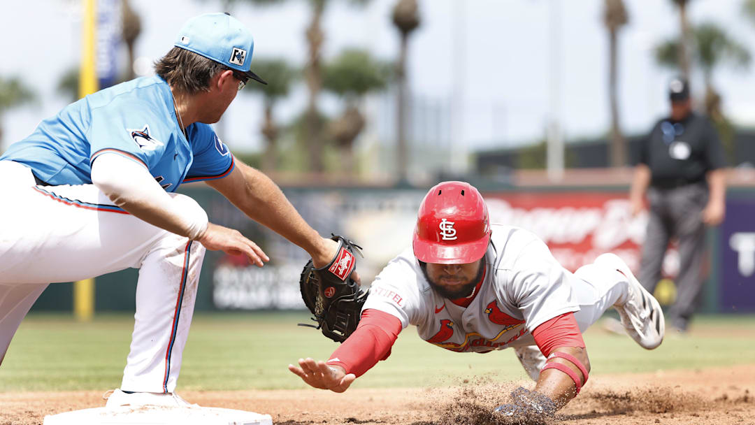 Mar 16, 2025; Jupiter, Florida, USA; St. Louis Cardinals center fielder Victor Scott II (11) is picked off by Miami Marlins first baseman Jonah Bride (41) during the third inning at Roger Dean Chevrolet Stadium. Mandatory Credit: Rhona Wise-Imagn Images Mar 16, 2025; Jupiter, Florida, USA; St. Louis Cardinals center fielder Victor Scott II (11) is picked off by Miami Marlins first baseman Jonah Bride (41) during the third inning at Roger Dean Chevrolet Stadium. Mandatory Credit: Rhona Wise-Imagn Images