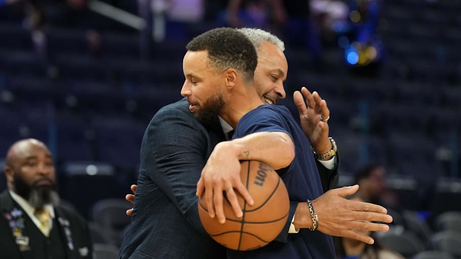 Charlotte Hornets color commentator Dell Curry (left) and Golden State Warriors guard Stephen Curry. | Darren Yamashita-Imagn Images