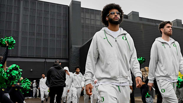 Oregon Ducks Dante Moore NFL Draft Mock Dan Lanning NIL Nike Phil Knight College Football Playoff Dolphins Browns Heisman