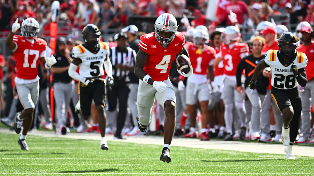 Ohio State wide receiver Jeremiah Smith (4) races away from Grambling State defenders for an 87-yard touchdown in the first quarter of the Buckeyes' 70-0 Week 2 win over the Tigers.