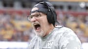 Washington Commanders head coach Dan Quinn celebrates on the sidelines after an interception pass against the Pittsburgh Steelers during the second half at Northwest Stadium. Mandatory Credit: Amber Searls-Imagn Images