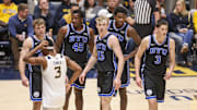 Feb 11, 2025; Morgantown, West Virginia, USA; Brigham Young Cougars players break from a huddle during the second half against the West Virginia Mountaineers at WVU Coliseum. Mandatory Credit: Ben Queen-Imagn Images