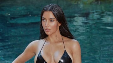 Kim Kardashian was photographed by Greg Swales in the Dominican Republic. Swimsuit by Good American. Sunglasses by Balenciaga. Helmet by Ruroc. 