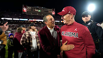 OU President Joseph Harroz Jr celebrates with coach Brent Venables 