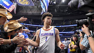 Mar 15, 2025; Nashville, TN, USA;  Florida Gators guard Walter Clayton Jr. (1) slaps hands with fans after the win against the Alabama Crimson Tide during the second half at Bridgestone Arena. Mandatory Credit: Steve Roberts-Imagn Images